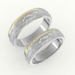 Goud met witgoud trouwring detail gravure en rij diamanten.