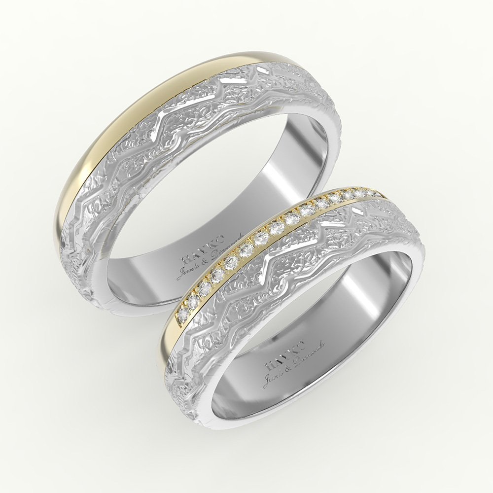 2ab-trouwringen-feb-2020-a-1.jpg Goud met witgoud trouwring detail gravure en rij diamanten.