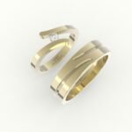 Gouden trouwring met open design, gezet met diamant.