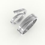 Witgouden trouwring met open design, gezet met diamant.