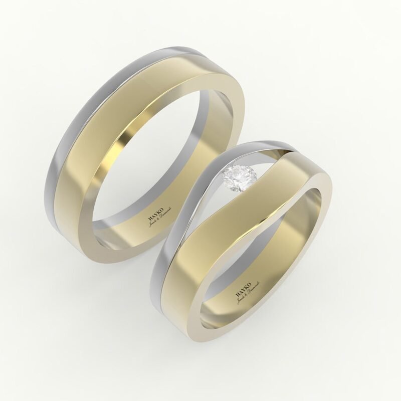 tweedelige trouwring in witgoud en goud met uitsparing voor diamant.