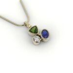 Gouden asymmetrische hanger gezet met diamant, saffier en peridot.