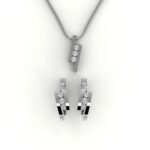 Set van witgouden hanger en oorbellen gezet met 3 diamanten per sieraad.