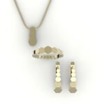 Set van gouden hanger, ring en oorbellen met hexagon design.