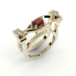 Gouden design ring gezet met diamanten en centrale robijn.