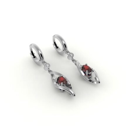 Gouden design oorbellen gezet met diamanten en centrale robijn.